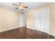 Bedroom with hardwood floors, ceiling fan and a closet at 4772 Lake Ridge Rd # 66, Orlando, FL 32808