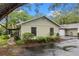 View of charming single-story home showing the garage and side entrance at 4772 Lake Ridge Rd # 66, Orlando, FL 32808