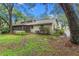 Charming single-story home with a screened porch and lush landscaping at 4772 Lake Ridge Rd # 66, Orlando, FL 32808