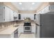 Beautifully remodeled kitchen with stainless steel appliances and modern finishes at 4772 Lake Ridge Rd # 66, Orlando, FL 32808