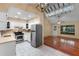 Open-concept kitchen with stainless steel appliances and tile backsplash at 4772 Lake Ridge Rd # 66, Orlando, FL 32808