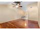 Spacious living room with hardwood floors, a ceiling fan, and natural light at 4772 Lake Ridge Rd # 66, Orlando, FL 32808