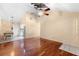 Spacious living room with hardwood floors, a ceiling fan, and natural light at 4772 Lake Ridge Rd # 66, Orlando, FL 32808