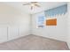 Bright bedroom featuring neutral carpet, a ceiling fan, and decorative blue accents at 4783 Riverwalk Dr, St Cloud, FL 34771