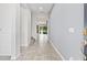 Bright foyer with tile flooring, leading into an open living space with views of the backyard at 4783 Riverwalk Dr, St Cloud, FL 34771