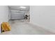 Spacious garage offering ample room for parking and storage, with an open garage door at 4783 Riverwalk Dr, St Cloud, FL 34771