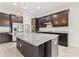 Well-appointed kitchen featuring granite countertops, a center island, and stainless steel appliances at 4783 Riverwalk Dr, St Cloud, FL 34771