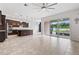 Spacious kitchen with dark cabinetry, granite countertops, stainless steel appliances, and an island at 4783 Riverwalk Dr, St Cloud, FL 34771