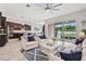 Open-concept living room with tile flooring, recessed lighting, and large sliding glass doors at 4783 Riverwalk Dr, St Cloud, FL 34771