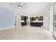 Open-concept living area featuring tile flooring, an island kitchen, and sliding glass doors to the outdoors at 4783 Riverwalk Dr, St Cloud, FL 34771