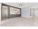 Inviting living room with tile flooring, a modern accent wall, and neutral paint colors at 4783 Riverwalk Dr, St Cloud, FL 34771