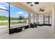 Enclosed patio with ceiling fans and view of fenced in backyard at 4783 Riverwalk Dr, St Cloud, FL 34771