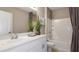 Bathroom with a single sink, a tub-shower combo, and neutral decor, creating a relaxing space at 531 Wayland Dr, Haines City, FL 33844