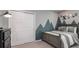 Bedroom with a gray bed and a sliding closet door with mountain wall decor at 531 Wayland Dr, Haines City, FL 33844