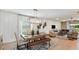 Open-concept dining area seamlessly connected to the living room with natural light at 531 Wayland Dr, Haines City, FL 33844