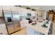 Open-concept kitchen with stainless steel appliances and a large island perfect for entertaining at 531 Wayland Dr, Haines City, FL 33844