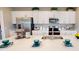 Modern kitchen featuring stainless steel appliances, white cabinetry, and a spacious island at 531 Wayland Dr, Haines City, FL 33844
