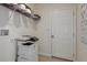 Well-equipped laundry room with a white door, printer, and shelving at 531 Wayland Dr, Haines City, FL 33844