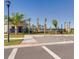 Community parking area near pool offers convenient access and well-manicured landscaping at 531 Wayland Dr, Haines City, FL 33844
