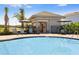 Tranquil poolside lounge area with comfortable seating offers a serene retreat at 531 Wayland Dr, Haines City, FL 33844
