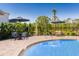 Inviting community pool features tables and lounge area with a scenic view at 531 Wayland Dr, Haines City, FL 33844