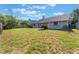 Expansive backyard featuring a mature lawn and privacy fence at 622 Tomlinson Ter, Lake Mary, FL 32746