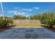 Spacious backyard with a mature wooden fence and two palm trees at 622 Tomlinson Ter, Lake Mary, FL 32746