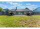 Expansive backyard featuring a patio, mature lawn, and privacy fence at 622 Tomlinson Ter, Lake Mary, FL 32746