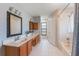 Bright bathroom featuring a tub and shower combination and a double sink vanity at 622 Tomlinson Ter, Lake Mary, FL 32746