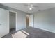 Bright bedroom features neutral walls, plush carpet, and two entry ways at 622 Tomlinson Ter, Lake Mary, FL 32746