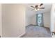 Bright bedroom features neutral walls, plush carpet, and a ceiling fan with light fixture at 622 Tomlinson Ter, Lake Mary, FL 32746