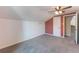 Bedroom with a grey carpet, light fixture, and a white door at 622 Tomlinson Ter, Lake Mary, FL 32746