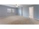 Large, bright bedroom with a neutral carpet, ceiling fan, and a window with blinds at 622 Tomlinson Ter, Lake Mary, FL 32746