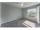 Bedroom with modern grey walls, carpet, and lots of natural light at 622 Tomlinson Ter, Lake Mary, FL 32746