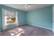 Cozy bedroom with blue walls, plush carpet, and lots of natural light at 622 Tomlinson Ter, Lake Mary, FL 32746