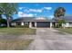 Charming single-story home with a well-maintained lawn, mature tree, and a two car garage at 622 Tomlinson Ter, Lake Mary, FL 32746