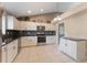 Spacious kitchen featuring granite countertops, stainless appliances, and ample storage at 622 Tomlinson Ter, Lake Mary, FL 32746