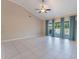 Large living room featuring vaulted ceilings, tile flooring, and natural light from large windows at 622 Tomlinson Ter, Lake Mary, FL 32746