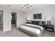 Comfortable bedroom with a walk-in closet, stylish decor, and a soothing color palette at 7274 Summer Ivy Aly, Orlando, FL 32829
