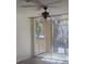 Screened-in balcony with ceiling fan overlooking the community at 7606 Pissarro Dr # 14206, Orlando, FL 32819