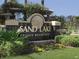 Elegant Sand Lake Private Residences community sign, surrounded by greenery at 7606 Pissarro Dr # 14206, Orlando, FL 32819
