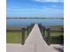 Wooden dock extending into a calm lake at 7606 Pissarro Dr # 14206, Orlando, FL 32819