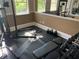 Brightly lit gym area featuring free weights and various exercise machines at 7606 Pissarro Dr # 14206, Orlando, FL 32819
