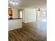 Bright living room with wood floors and sliding door to balcony at 7606 Pissarro Dr # 14206, Orlando, FL 32819