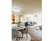 Open-concept living room featuring modern decor, hardwood floors, and plenty of natural light at 7606 Pissarro Dr # 14206, Orlando, FL 32819