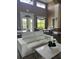 A stylish lobby features comfortable seating, a modern design, and large windows with natural light at 7606 Pissarro Dr # 14206, Orlando, FL 32819