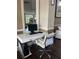 Office area with computer desk and chair, plus view into fitness area at 7606 Pissarro Dr # 14206, Orlando, FL 32819