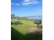 Outdoor grill and picnic table overlooking a tranquil lake at 7606 Pissarro Dr # 14206, Orlando, FL 32819