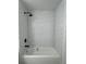 White shower with white subway tile and black fixtures at 7606 Pissarro Dr # 14206, Orlando, FL 32819