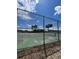 Tennis courts surrounded by green chain link fence at 7606 Pissarro Dr # 14206, Orlando, FL 32819